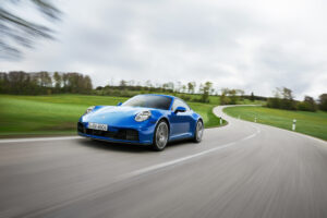 2025 Porsche 911 Carrera. Front 3/4 action. Image courtesy of Porsche