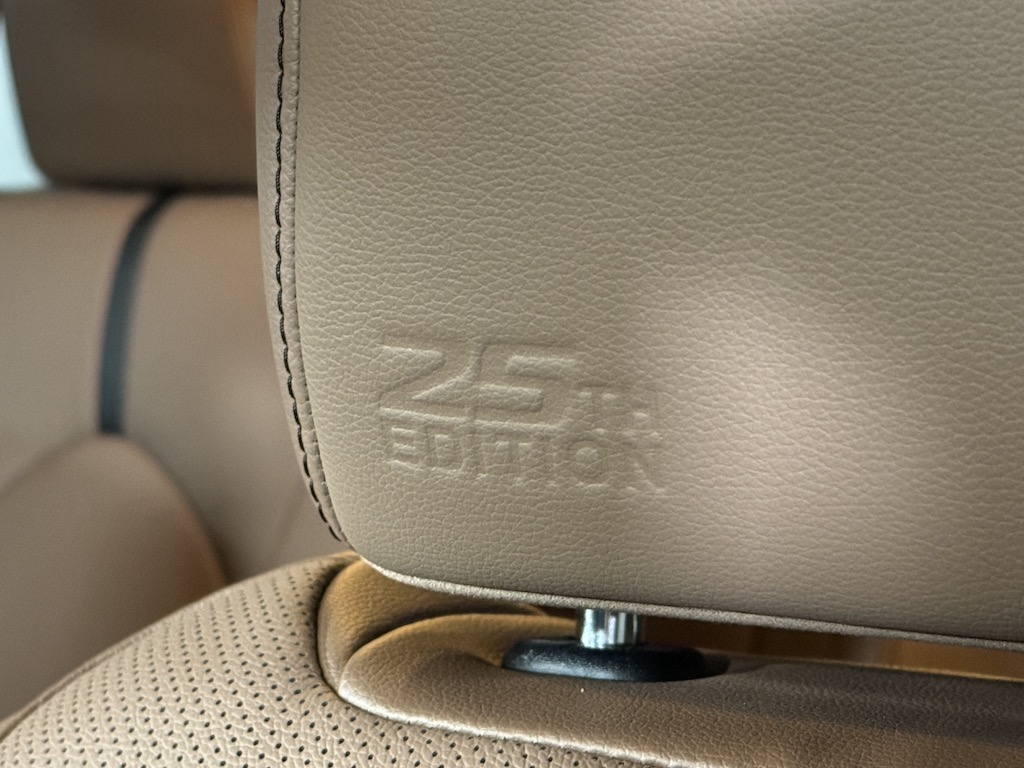 The 2025 Toyota Highlander Hybrid 25th Edition, embossed logo on seat back. Image by Robin Warner