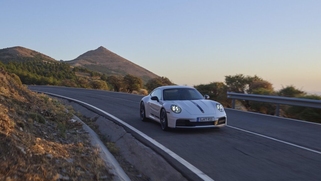 2025 Porsche 911 Carrera T, front 3/4 in motion. Image courtesy of Porsche