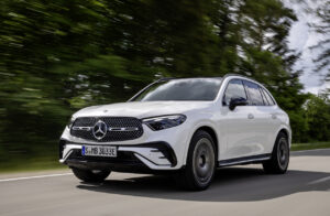 2025 Mercedes-Benz GLC 350e 4Matic plug-in hybrid, front 3/4 in motion. Image courtesy of Mercedes-Benz